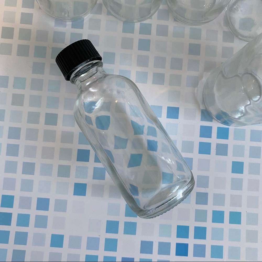 New! 4 set, empty 2 oz clear glass bottles with black cap.